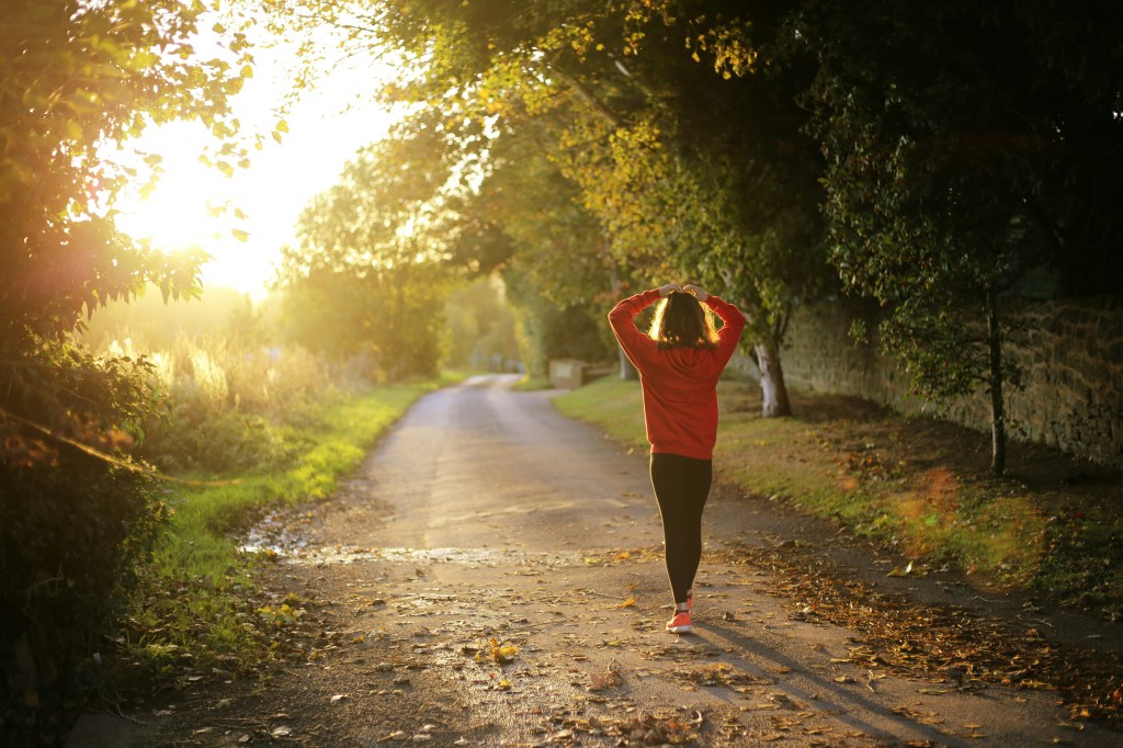 girl walking in woods getting fresh air